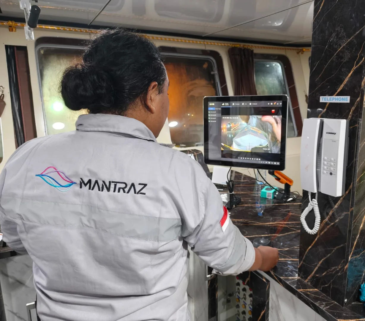 MANTRAZ engineer operating an onboard control panel